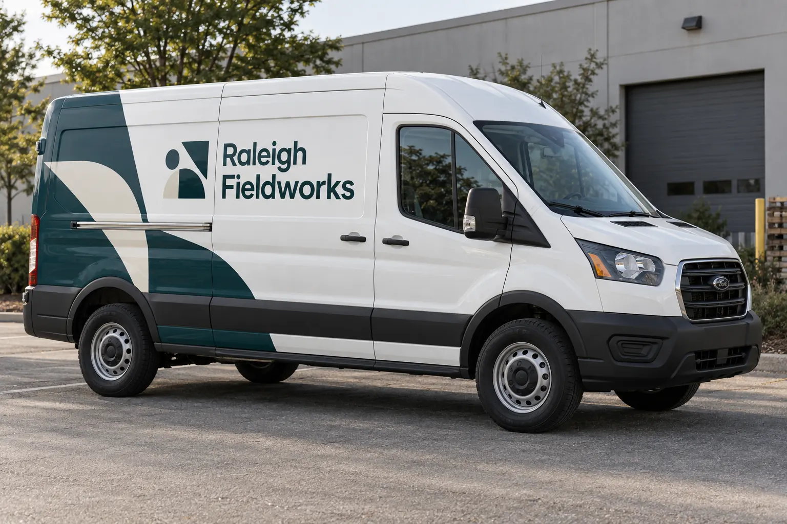 Van Sliding Door Graphics Alignment Guide — fictional commercial concept Fictional Raleigh Fieldworks white van with teal graphics and closed sliding cargo door